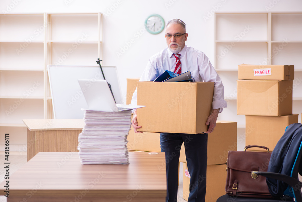Old businessman employee in relocation concept Old businessman employee in relocation concept