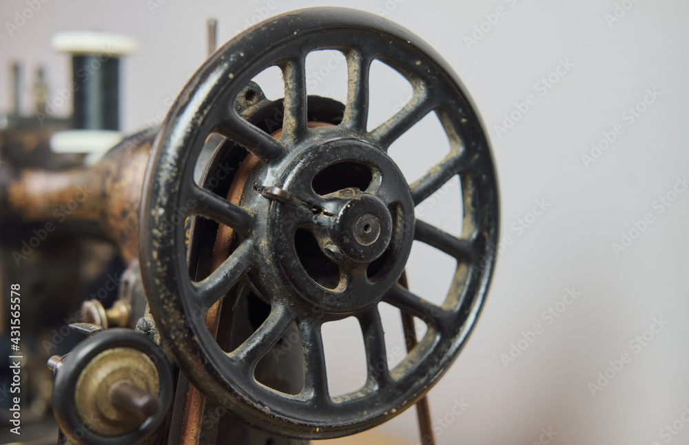 Close-up of a vintage hand sewing machine. Selective focus.