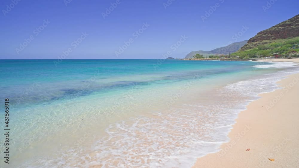 Blue Ocean, Yellow Sandy Beach Nature Tropical Islands Oahu Hawaii. Pacific Ocean. Turquoise sea background. Clear sunny day in the tropics. Blue Ocean, Yellow Sandy Beach Nature Tropical Islands Oahu Hawaii. Pacific Ocean. Turquoise sea background. Clear sunny day in the tropics.