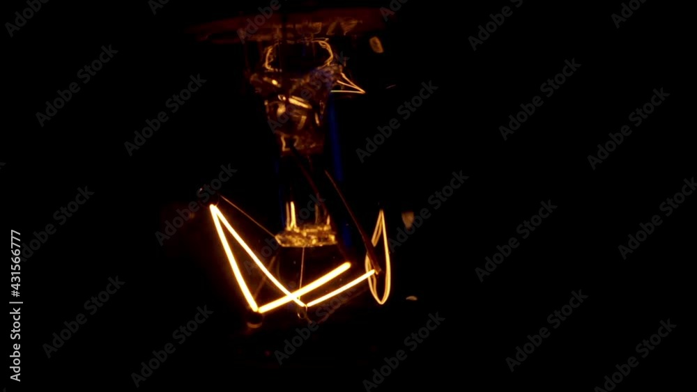 Real light bulb turning on, flickering and turning off. Incandescence thread, close up. Loop. Real light bulb turning on, flickering and turning off. Incandescence thread, close up. Loop.
