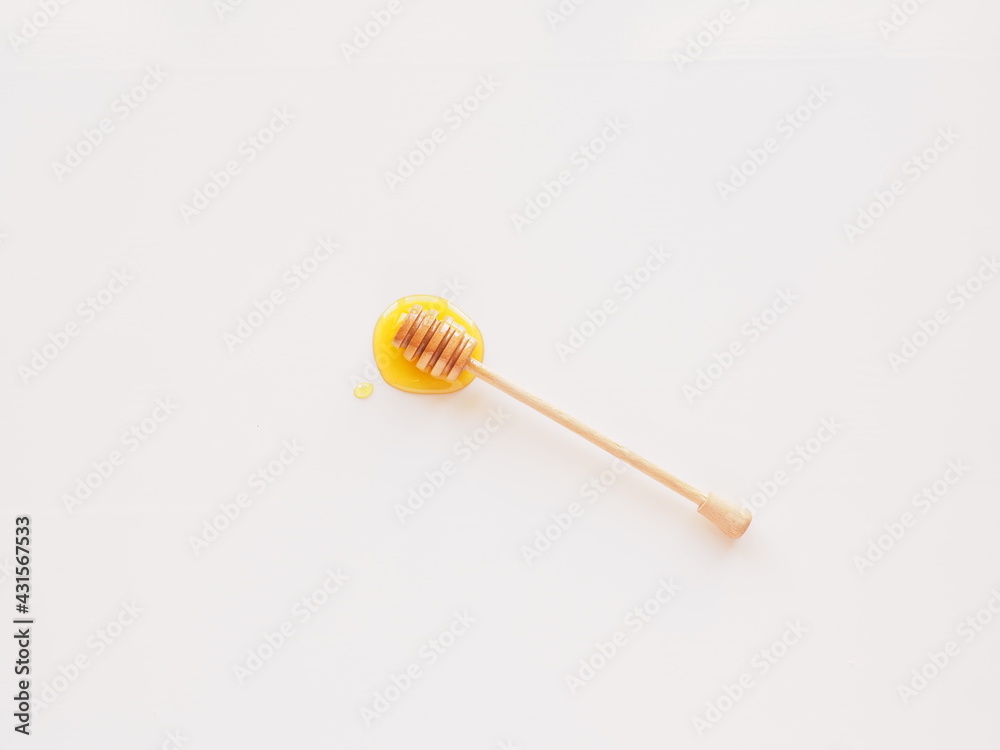 Wooden honey dipper still life isolated on white Wooden honey dipper still life isolated on white
