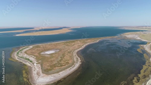 Flight over an islet in a shallow lake