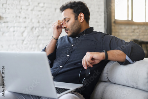 Konstfotografi Tired mixed-race hindu male entrepreneur take glasses off and feel eye strain fr
