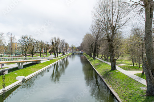 View of the water canal in the park in the city of Gi  ycko