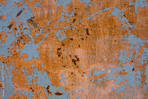 Grunge rusty iron metal wall background with blue painted drops. Retro and vintage background concept