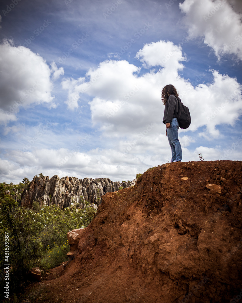 Young woman hiking in the natural monument of Cerro del Hierro, Seville Spain