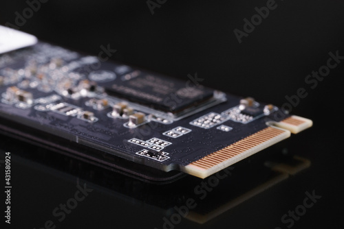 Obraz na płótnie SSD M2 disk close up with selective focus on the interface w salonie