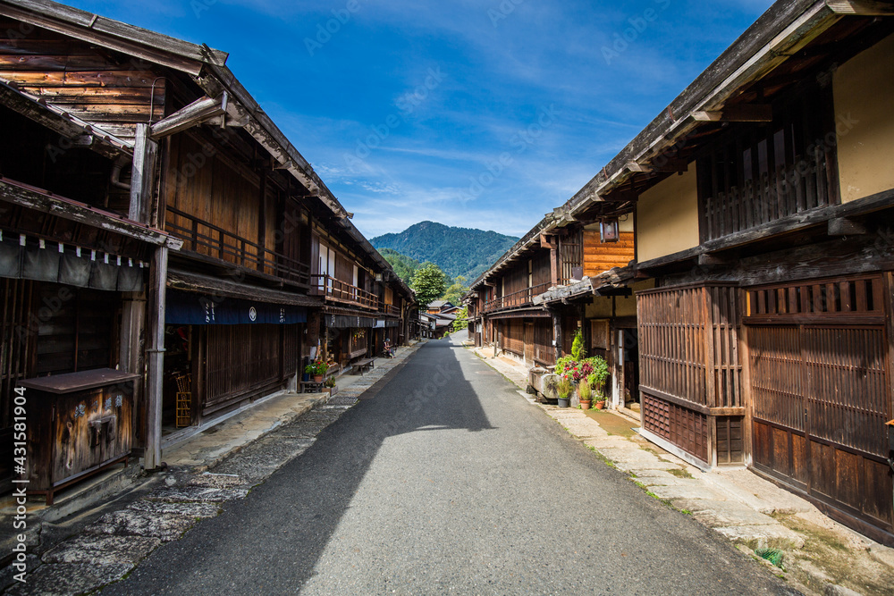Old Japanese post town of Tsumago. Japanese tourist landmark village. Historic restored village on the Nakasendo trail in the Kiso Valley, Japan.