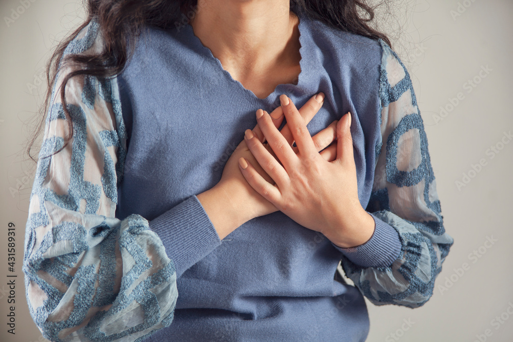 woman hand in ache heart woman hand in ache heart