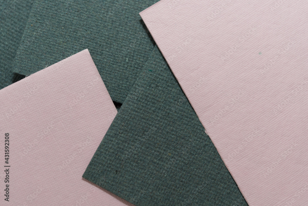 Fototapeta premium overlapping dusty pink and grey textured paper 