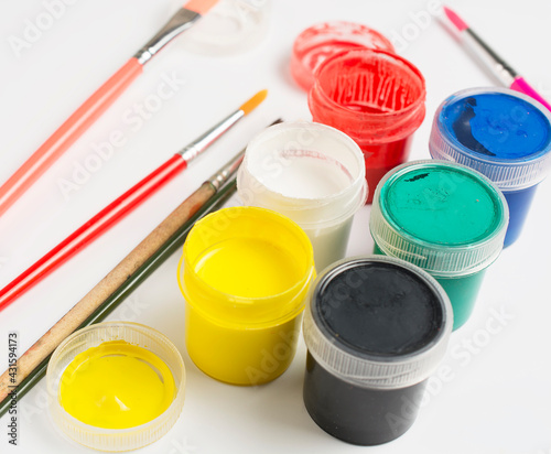 Wallpaper Mural jars with acrylic paint and small brushes on a white background. Torontodigital.ca