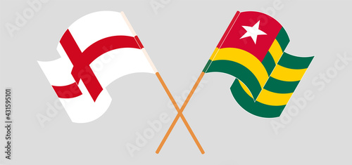 Crossed and waving flags of England and Togo