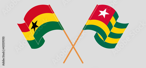 Crossed and waving flags of Ghana and Togo