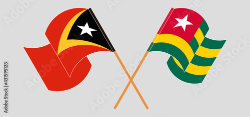Crossed and waving flags of East Timor and Togo