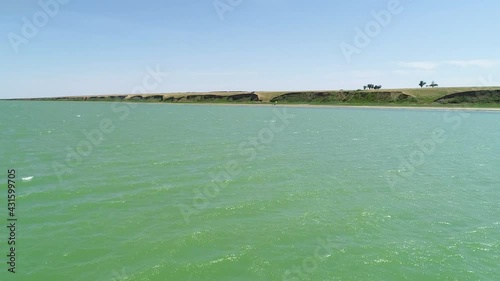Flight over the smooth surface of the water of an artificial reservoir