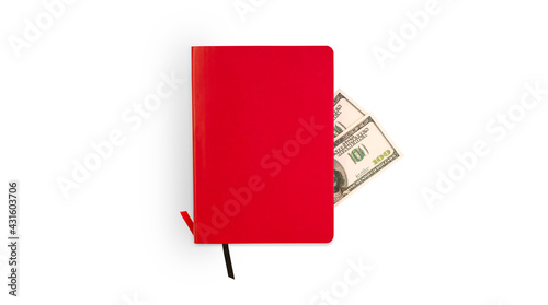 dollars in red notepad on white background