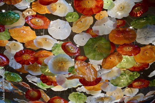 Glade of artificial plastic interior colors. Yellow brown red white flowers for interior decoration