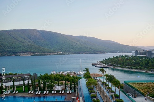 Bodrum, Turkey - August 2020: Hotel beach Lujo. Vacation in Paradise. Beautiful tropical beach banner. White sand travel tourism wide panorama background concept. Amazing beach landscape, yachts