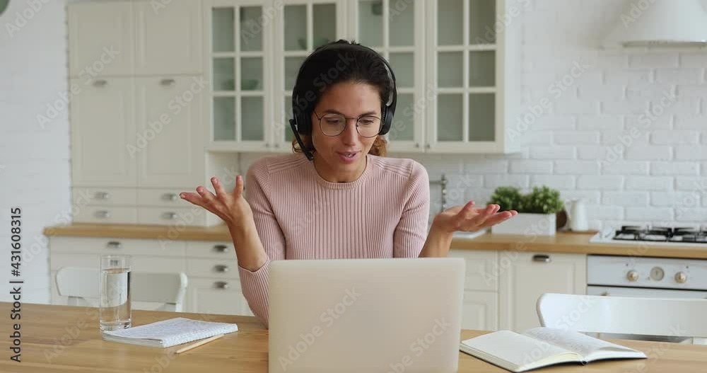 Businesswoman wear headset talk to colleague solve business use videocall app on laptop. E-learn with online tutor, gain new knowledge, give receive professional assistance by video call event concept