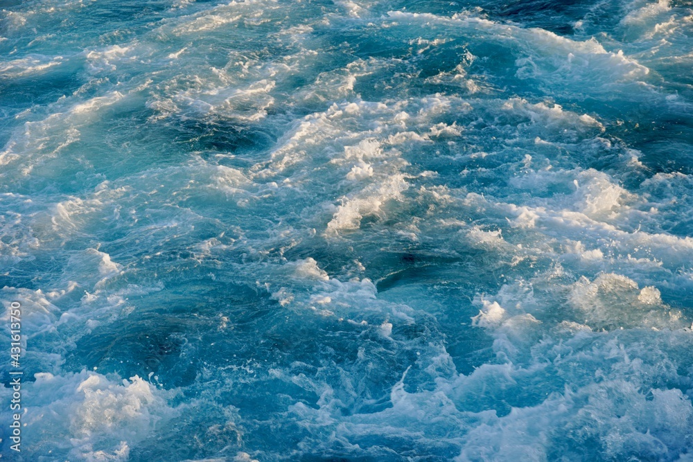 Footprint on the water after the ship. Bubbling water texture. The ...