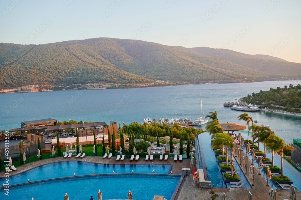 Bodrum, Turkey - August 2020: Hotel beach Lujo. Vacation in Paradise. Beautiful tropical beach banner. White sand travel tourism wide panorama background concept. Amazing beach landscape, yachts