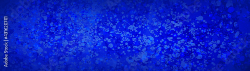 blue background with abstract texture pattern of paint spatter in dark and light blue