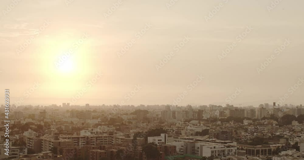 Lima cityscape as sun sets behind the Pacific Ocean Lima cityscape as sun sets behind the Pacific Ocean