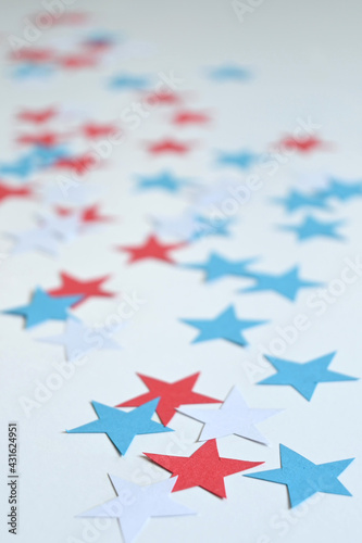 Background of five-pointed stars of the color of the usa flag, red, blue, white