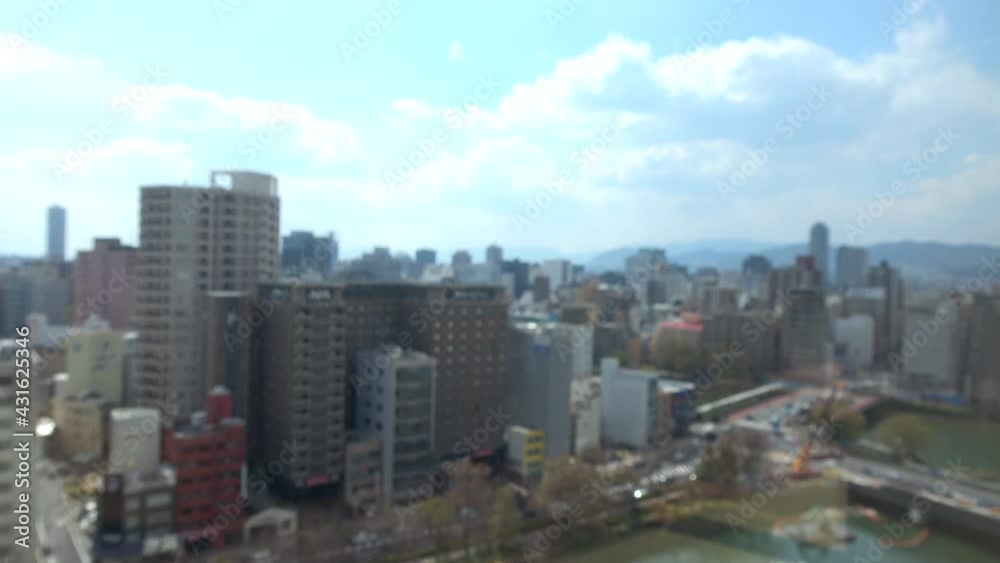 Blurred shot of the skyline of Hiroshima city, Japan. Neighborhood area of Hiroshima station. 4K. March 29, 2021 Blurred shot of the skyline of Hiroshima city, Japan. Neighborhood area of Hiroshima station. 4K. March 29, 2021