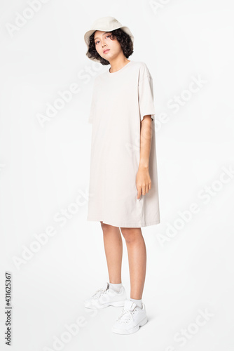 Woman in white t-shirt dress and bucket hat casual wear apparel