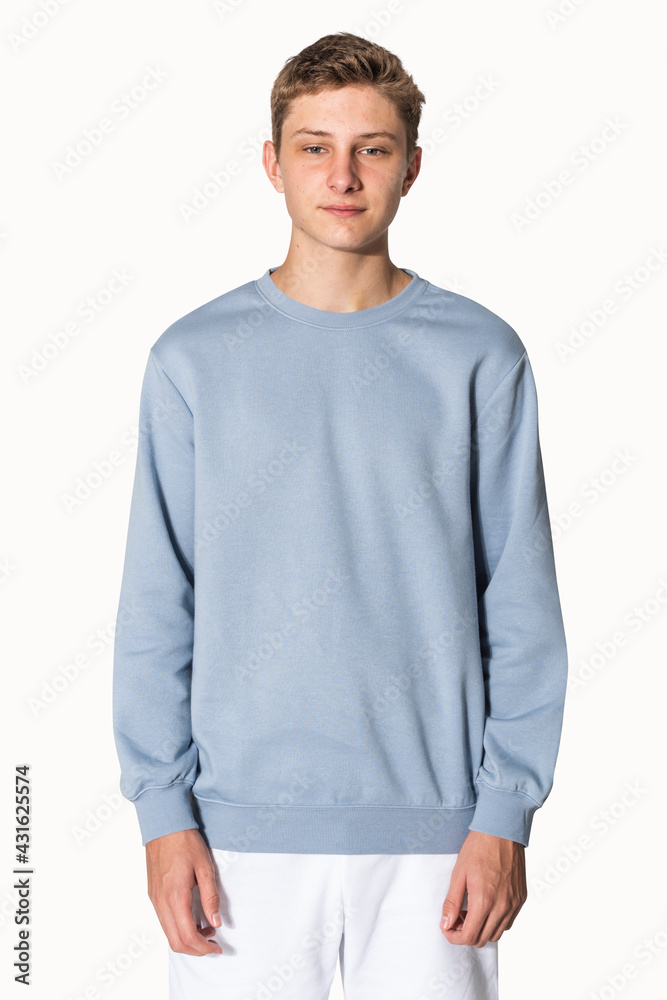 Teenage boy in blue sweater winter apparel portrait Teenage boy in blue sweater winter apparel portrait
