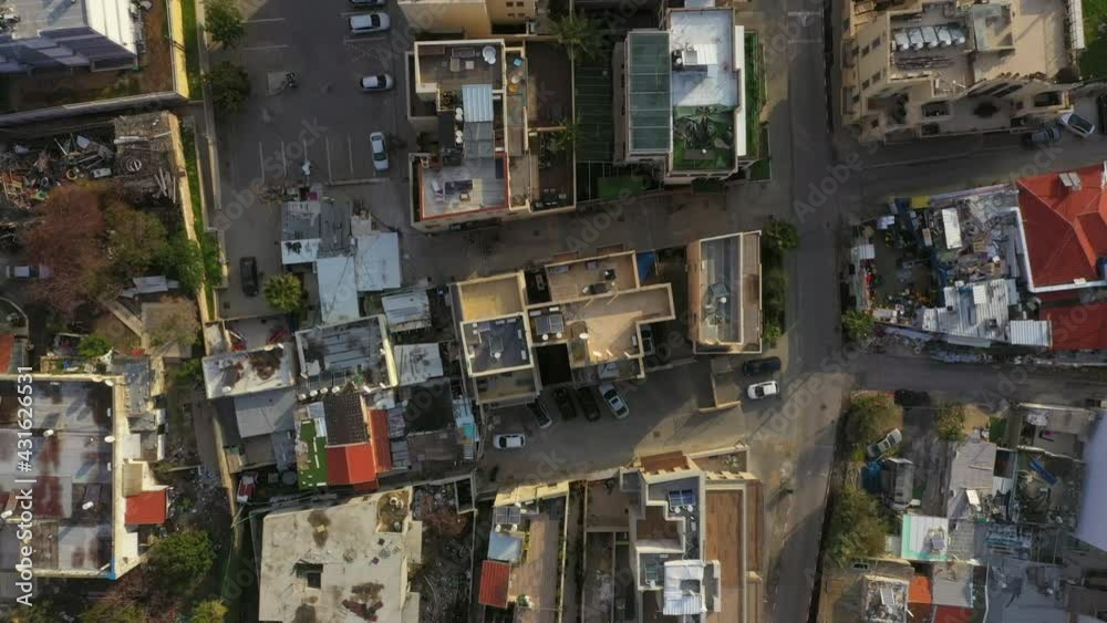 Aerial Top View Of By Houses And Vehicles In Coastal City, Drone Flying Forward Over Residential Structures - Jaffa, Israel Aerial Top View Of By Houses And Vehicles In Coastal City, Drone Flying Forward Over Residential Structures - Jaffa, Israel