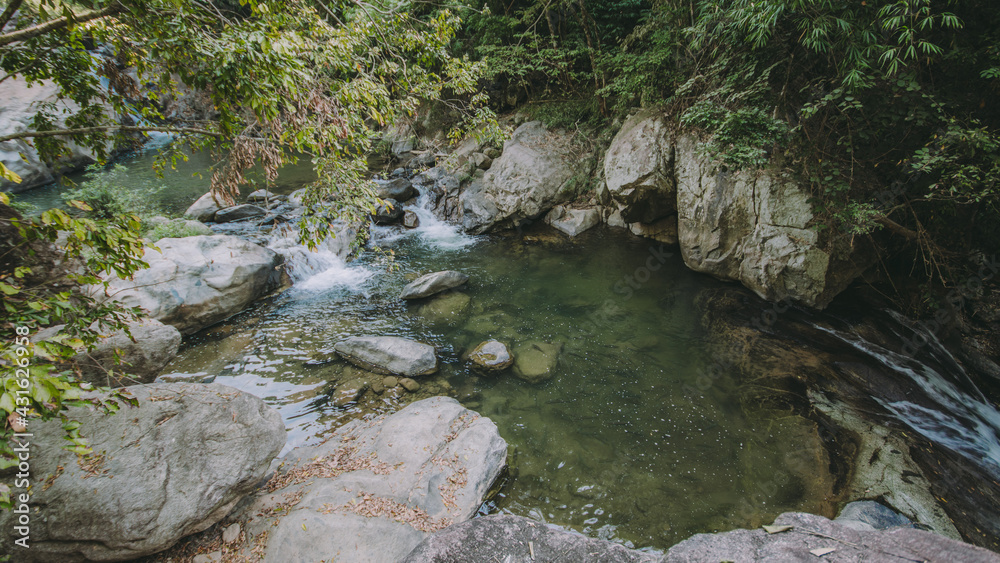 Waterfall in the forest in the middle of the valley. Waterfall in the forest in the middle of the valley.