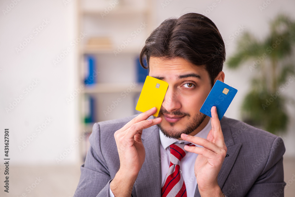 Young businessman employee in ecommerce concept Young businessman employee in ecommerce concept