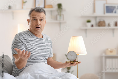 Confused mature man with al...