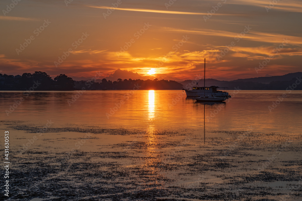 Sunrise waterscape with boats and soft colour Sunrise waterscape with boats and soft colour