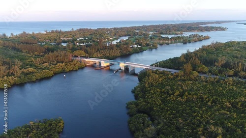 This is a shot of the Hobe Sound Draw Bridge Aerial At Sunset in Florida along the coast. photo