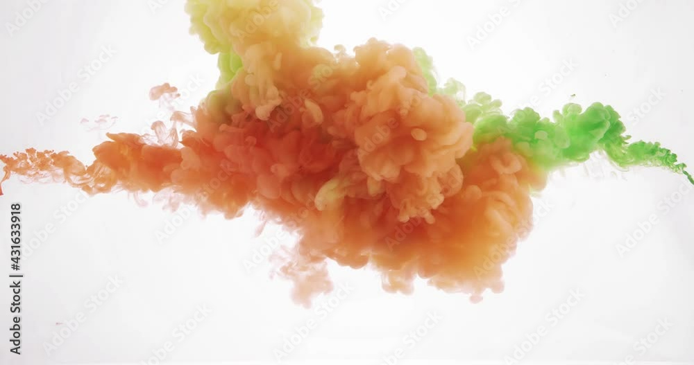 Orange and green ink mixing in water on white background
Orange and green ink mixing in water on white background