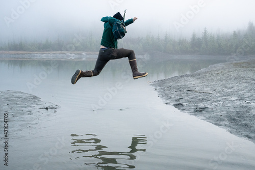 Jumping over a gap at the Mendenhall Lake photo