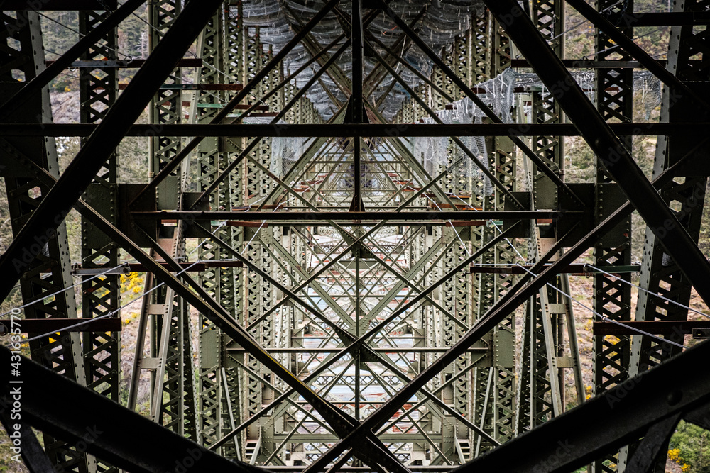 Fototapeta premium Steel support lines on the underside of a bridge