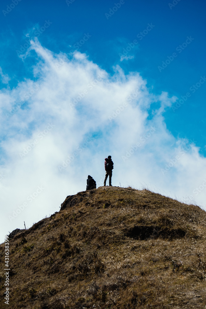 hiker on top of mountain hiker on top of mountain