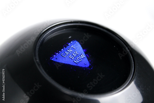 Fotografi Black prediction ball for decision making.