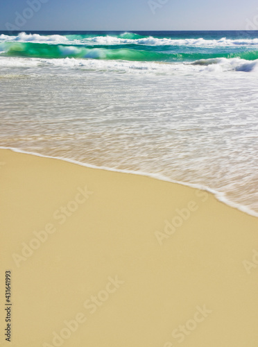 Waves rolling into shore photo