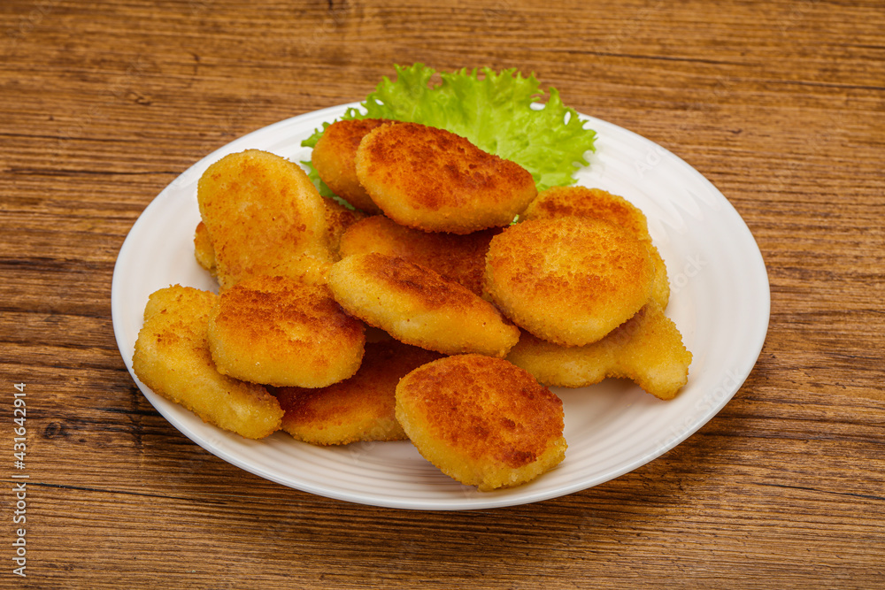 Fried chicken nuggets served salad leaves