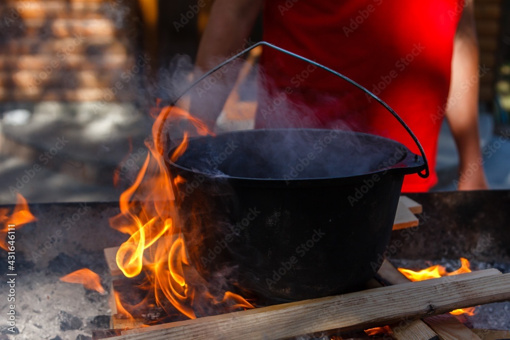 Bowler cooking food bonfire cauldron, pot. Bowler cooking food bonfire cauldron, pot.