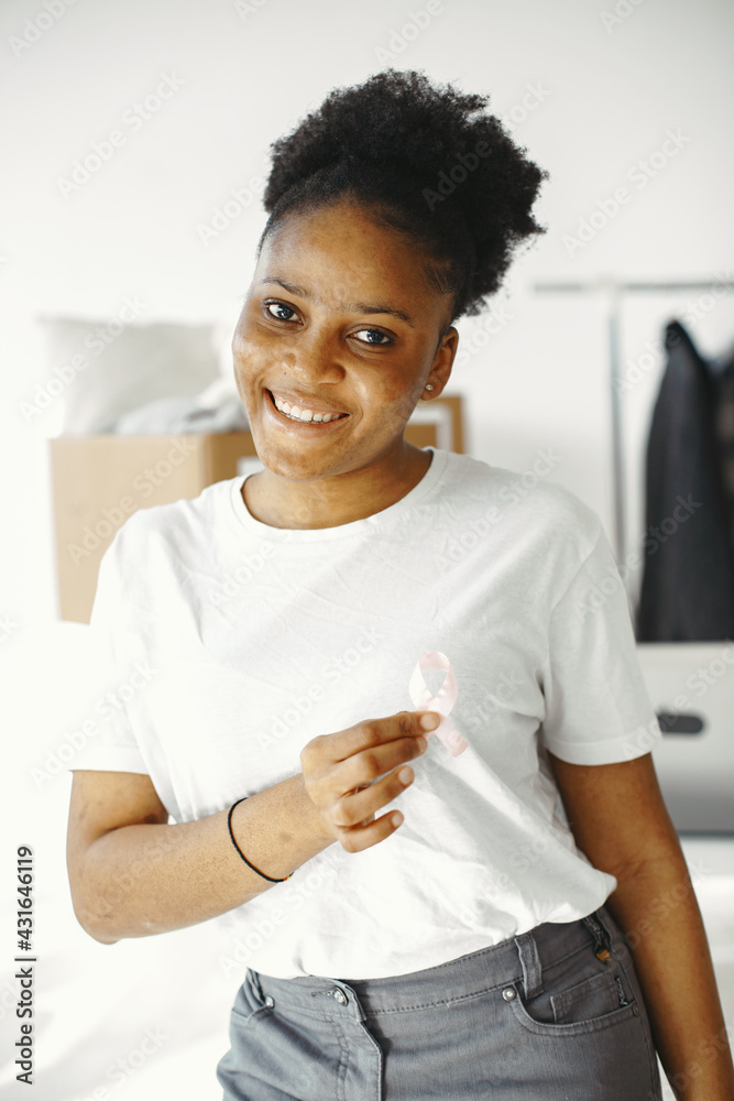 African girl in white t-shirt with AIDS sign African girl in white t-shirt with AIDS sign