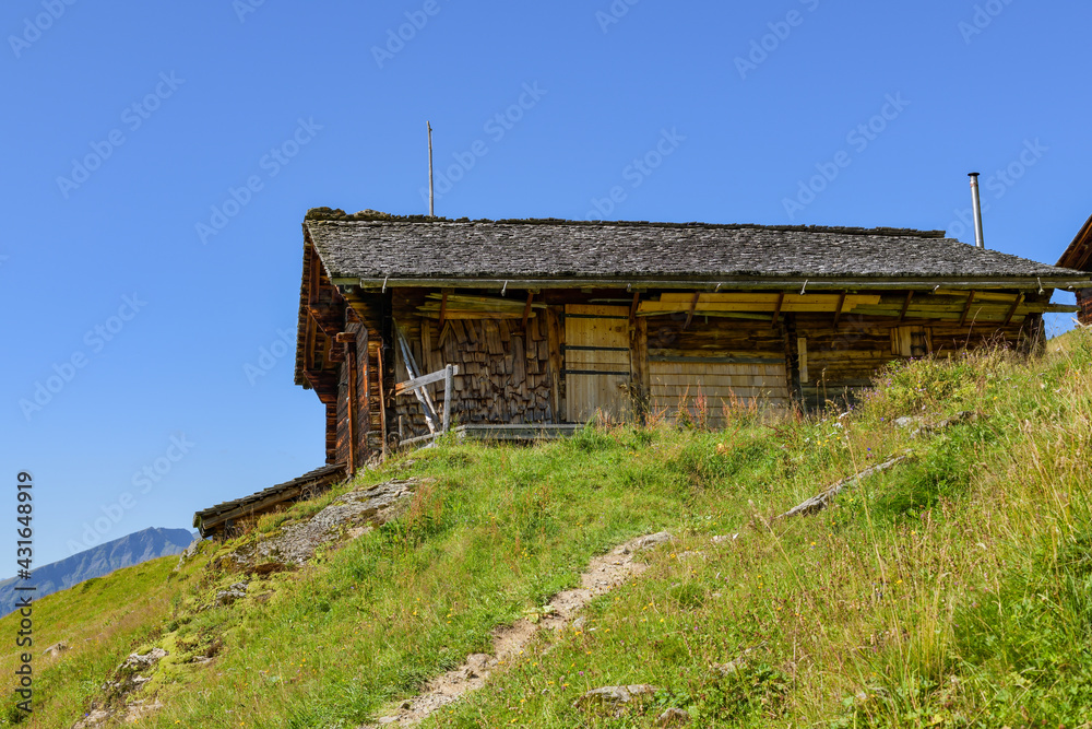 Old wooden lodge on hiking trail above the Hasliberg in Switzerland
