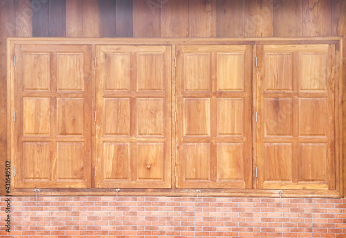 Fototapeta Naklejka Na Ścianę i Meble -  Wooden window brown plank wall in vertical and brick background