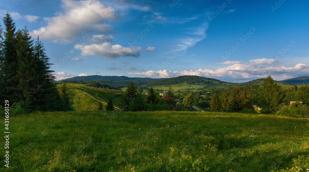 Panorama of mountains on a summer day against the background of the sky with clouds Panorama of mountains on a summer day against the background of the sky with clouds