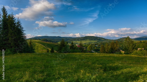 Panorama of mountains on a summer day against the background of the sky with clouds